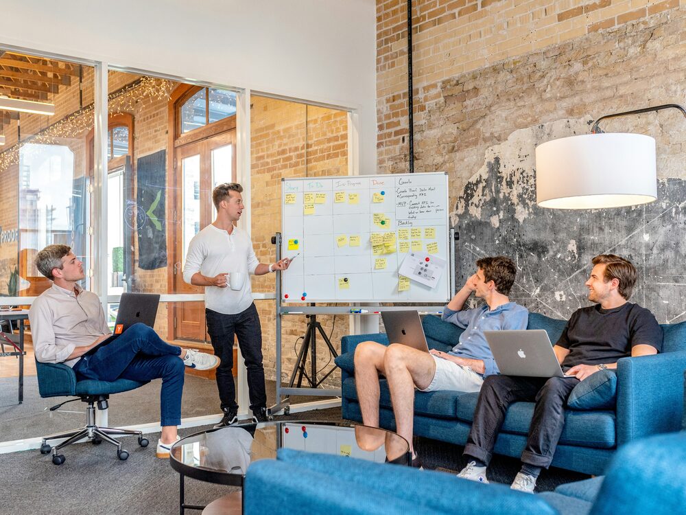 Team reviewing a campaign board